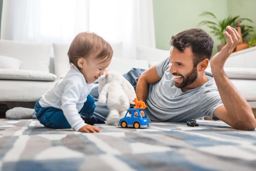 Dad following the lead of his toddler son